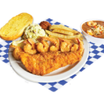 Fisherman's Plate with 1 fried cod, 6 fried shrimp, and a cup of gumbo served with cole slaw, fries, hush puppy, and bread. The plate is placed on top of a white and blue checker paper