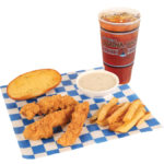 Three chicken tenders, garlic bread, gravy, french fries, and a large tea placed on blue and white checkered paper