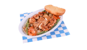 Fish & Shrimp Mexican Style includes 1 Grilled Cod Filet, 6 Grilled Shrimp with the choice of one side, and bread. On a white and blue checkered paper.