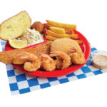 Fisherman's Platter includes 1 Fried Cod Filet, 4 Fried Shrimp, 1 Crab Cake, with Fries, Coleslaw, Bread, & a Hush Puppy.