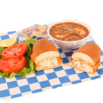 Fish Sandwich with lettuce, tomato, tartar sauce, cup of gumbo, & crackers