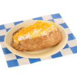 baked potato with sour cream and cheese on a blue and white checker paper
