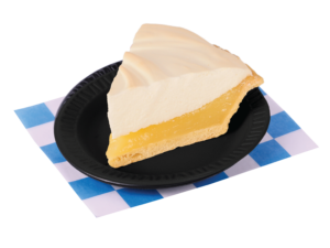 A slice of Lemon Meringue pie on a small black plate. Placed on a blue and white checkered paper.