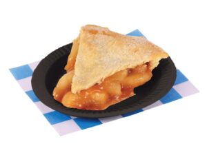 Apple pie slice on a black plate. Placed on a blue and white checkered paper.