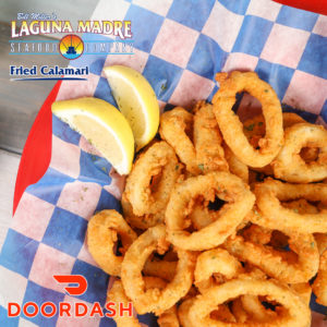Fried Calamari; Photo of an order of fried calamari served with lemon slices and marinara sauce. LagunaMadre logo. DoorDash logo.