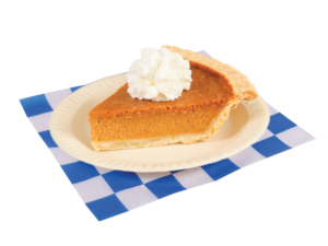Slice of pumpkin pie with whip cream plated on a white and blue checker paper