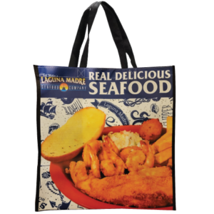 Laguna Madre reusable shopping bag with Laguna Madre logo Real delicious seafood and a picture of our fish and shrimp plate with a nautical background