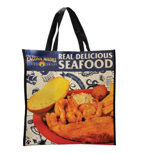 Laguna Madre reusable shopping bag with Laguna Madre logo Real delicious seafood and a picture of our fish and shrimp plate with a nautical background