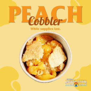 Peach Cobbler. While supplies last; Image of two portions of peach cobbler on a yellow background with peach icons. Laguna Madre logo.