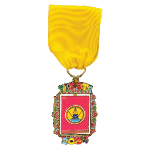 2024 Laguna Madre fiesta medal with a boat in the center of the medal and flowers surrounding the border.